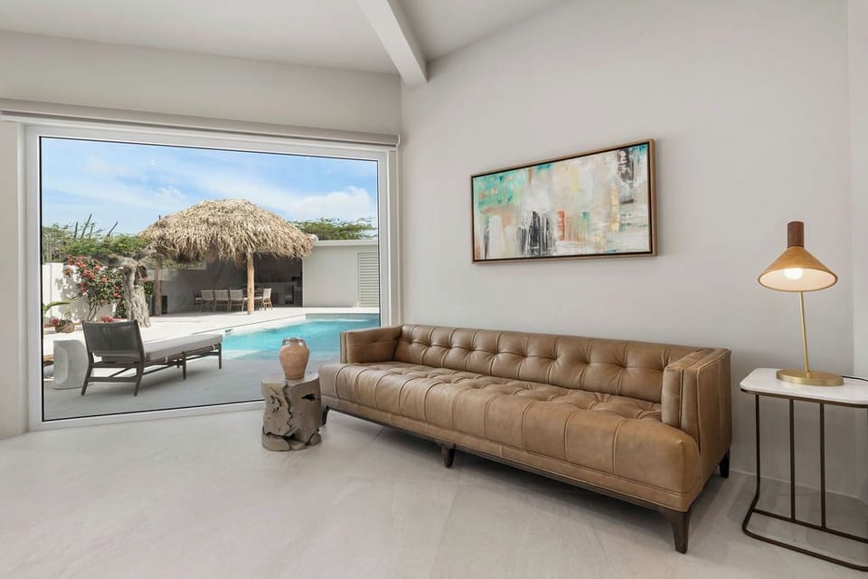 This home features a large, cozy sofa that’s perfect for lounging, movie nights, or entertaining guests. With plenty of room for everyone, it’s designed to provide both style and comfort, making your living space the ultimate spot to unwind.