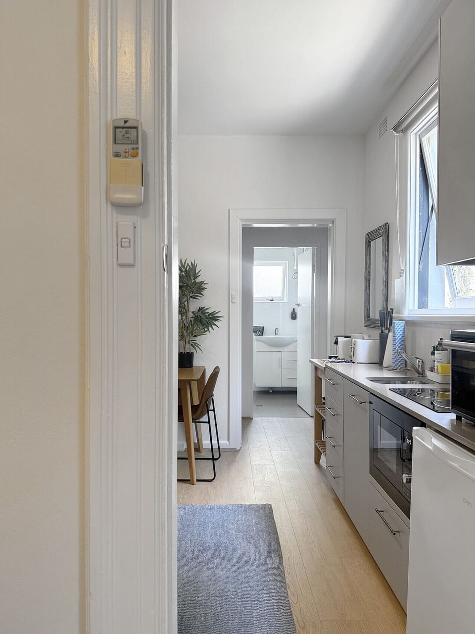 the kitchen and view to bathroom