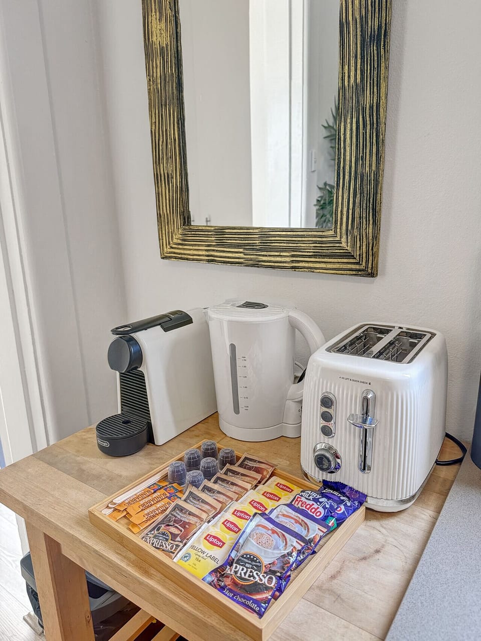 kitchen includes a Nespresso machine and coffee pods