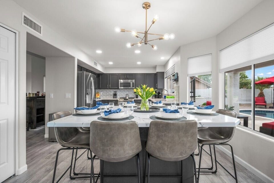 Gather around! The spacious dining table comfortably seats eight for family meals or festive dinners.