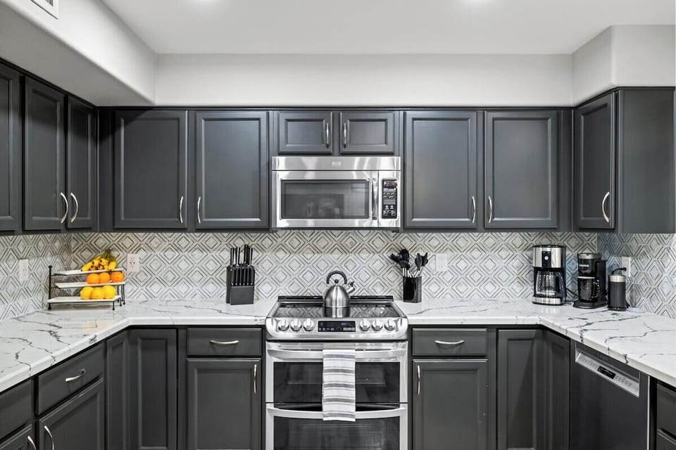 Generous counter space and an eat-up bar make this kitchen both functional and stylish.