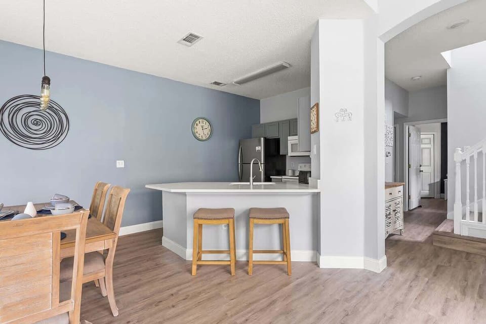 Spacious fully equipped kitchen connected to the dining area.