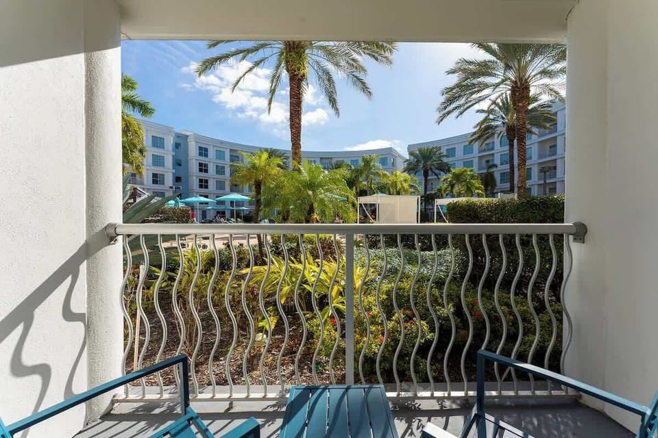 A private balcony with a breathtaking pool view, offering the perfect spot to unwind.