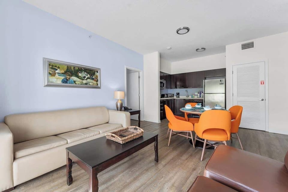 A cozy living room with an open-concept dining and kitchen, perfect for family time.