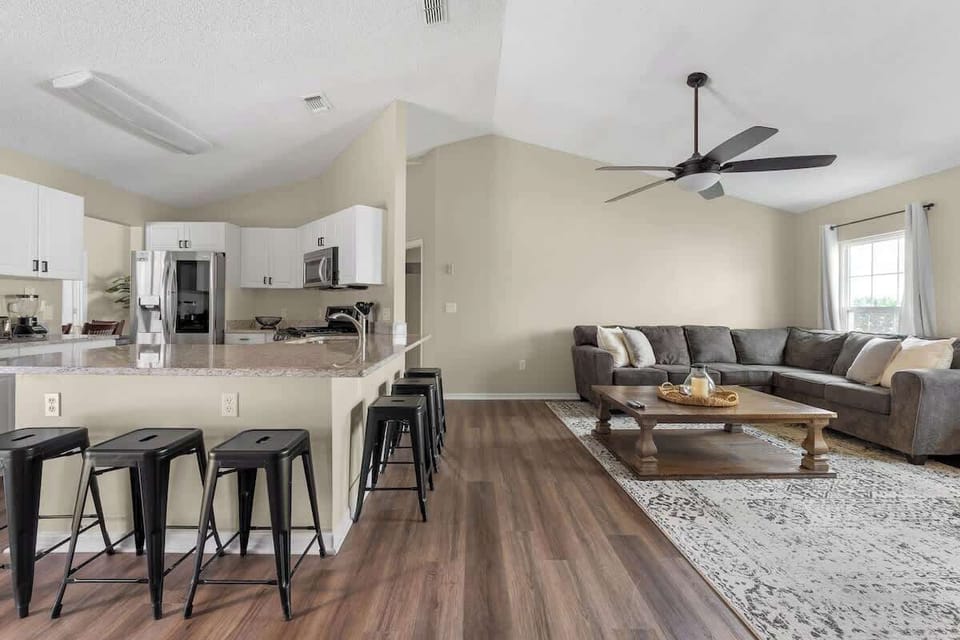 A spacious open-plan family room and kitchen, perfect for bonding, cooking, and relaxing.