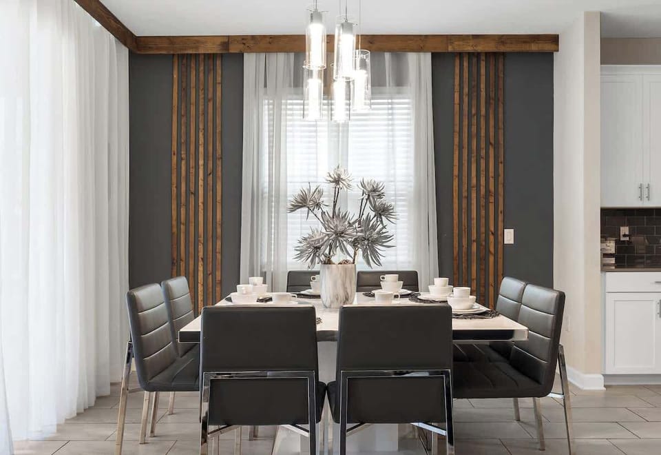 The open-concept dining room with 8 seats offers comfort for your family.