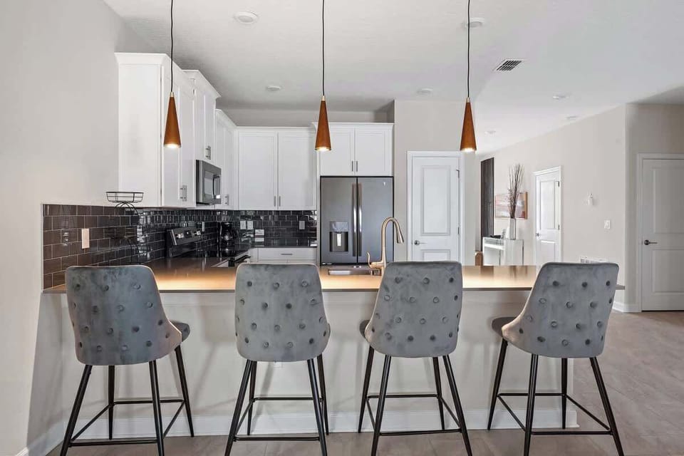 Unleash your culinary creativity in this fully equipped kitchen boasting sleek stainless steel appliances, perfect for gourmet cooking and culinary adventures.