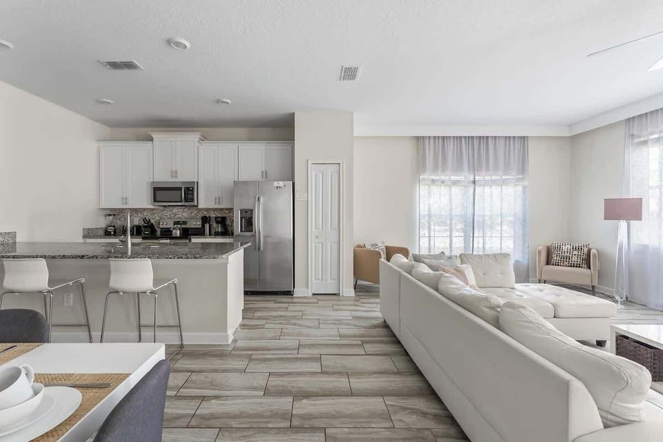 The cozy and inviting living room, designed for ultimate comfort and relaxation. This space features plush sofas and stylish furnishings, perfect for lounging after a day of adventures.
