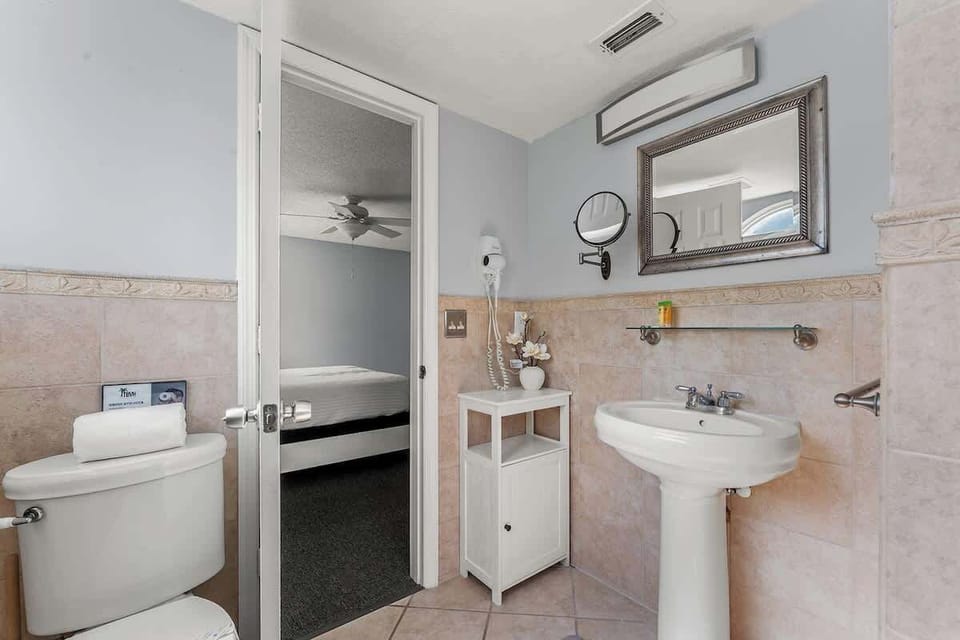 The master bathroom is located in the king-size bedroom.