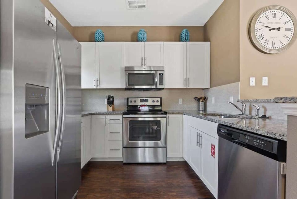 Beautiful kitchen view, fully equipped with stainless still appliances. 