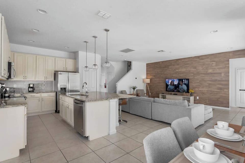 An open concept living room with charming and modern decoration.