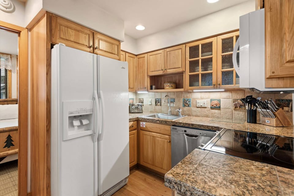 Prepare meals together in this charming kitchen with hand crafted tile.