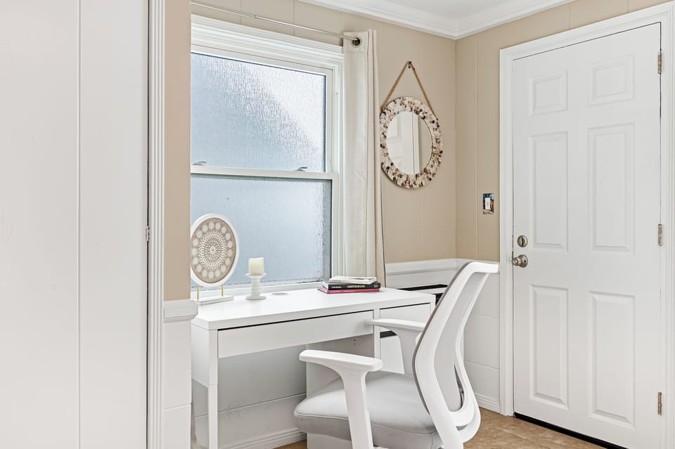 A cozy spot with a desk and chair – perfect for work or journaling.