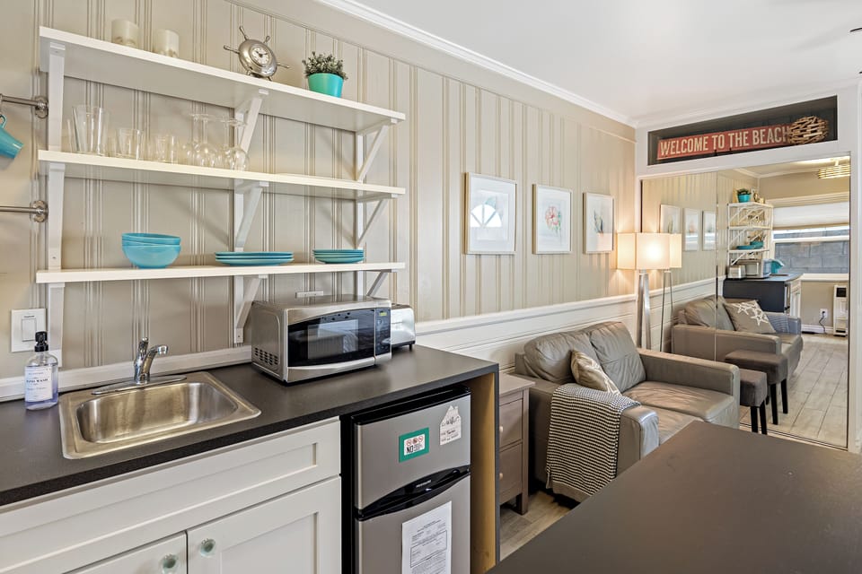 Compact kitchenette with all the essentials for a quick meal or morning coffee.