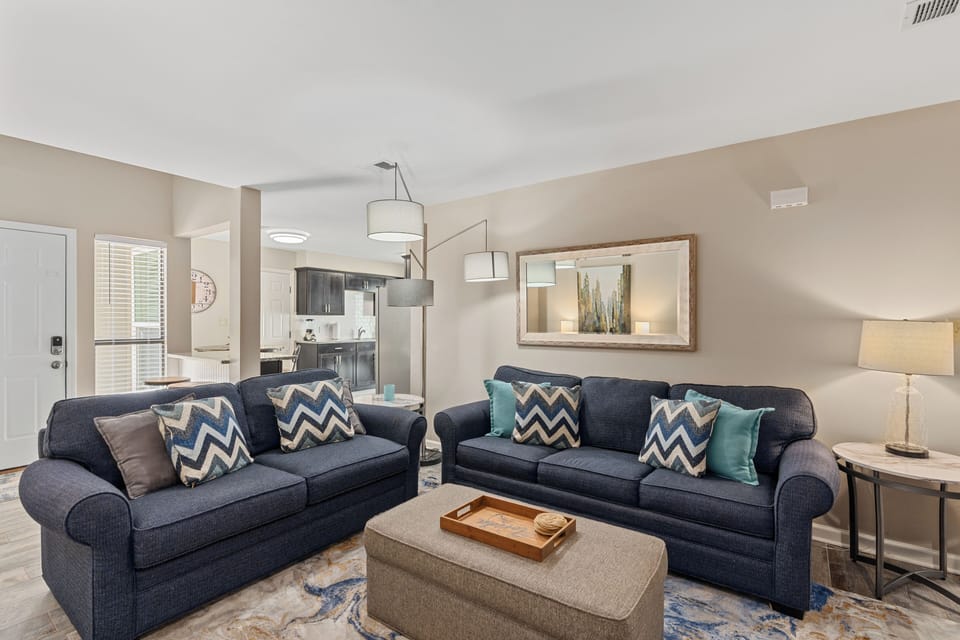 Spacious and comfortable living area with chic accents (Unit B)