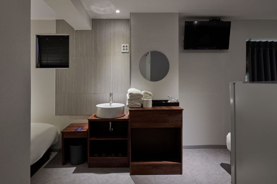 Family Twin Room | Desk, blackout drapes, iron/ironing board, free WiFi