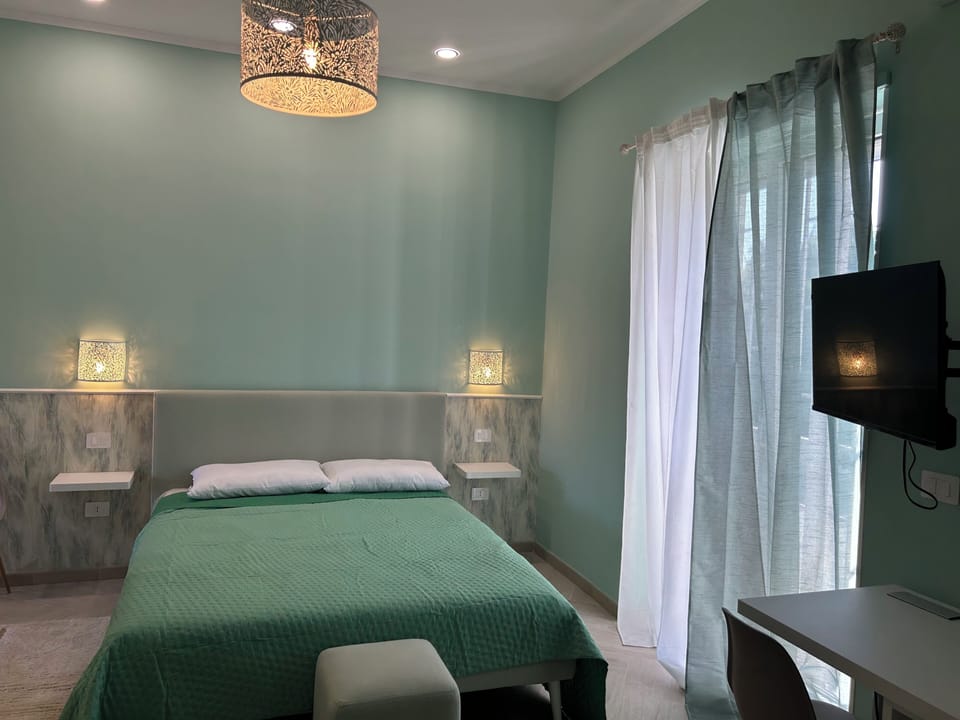 Comfort Quadruple Room, Garden View | Laptop workspace, free WiFi