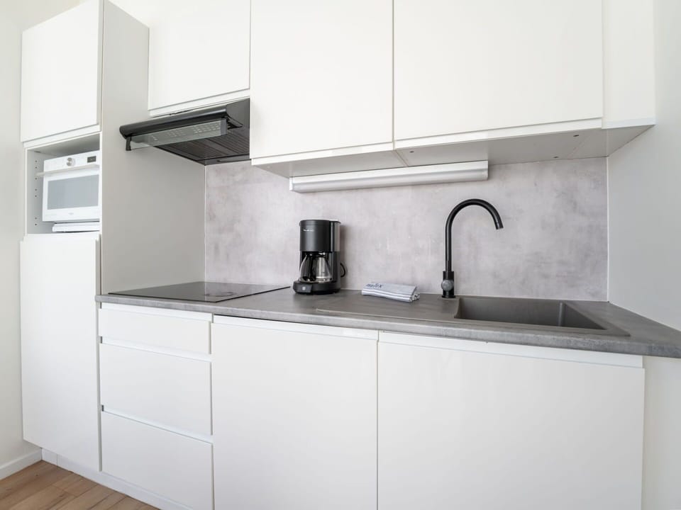 Countertop, Kitchen, Kitchen Appliance, Cabinetry, Flooring, Interior Design, Major Appliance, Floor, Kitchen Sink, Furniture