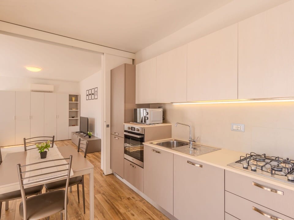 Kitchen, Countertop, Kitchen Appliance, Flooring, Interior Design, Major Appliance, Furniture, Wood, Cabinetry, Floor