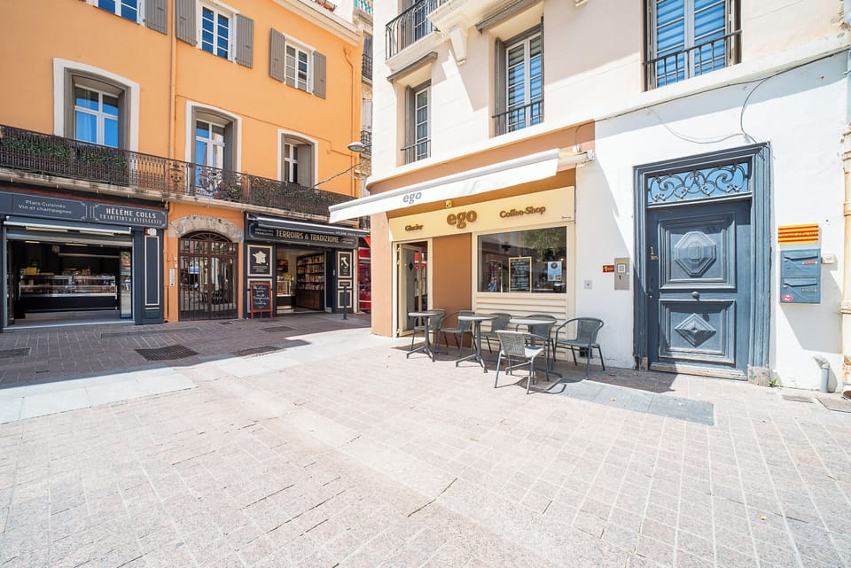 The building's entrance door is on your right in the photo