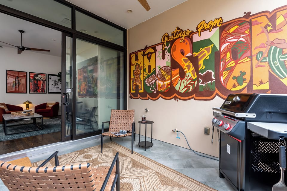 Step onto this stylish private balcony, where bold Houston-inspired street art, cozy seating, and a premium grill come together to create the perfect outdoor retreat. Whether you're sipping your morning coffee, enjoying an evening BBQ, or just soaking in the laid-back city vibes, this space is designed for relaxation and connection.