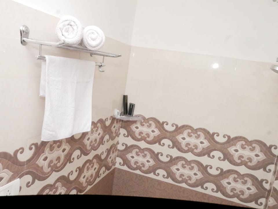 Shower, bathrobes, slippers, towels