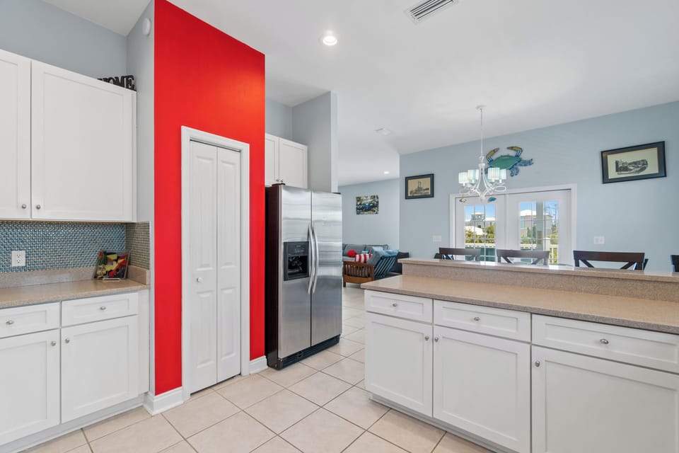 Your spacious kitchen features crisp white cabinets, granite counters, and modern stainless appliances for effortless meal prep.