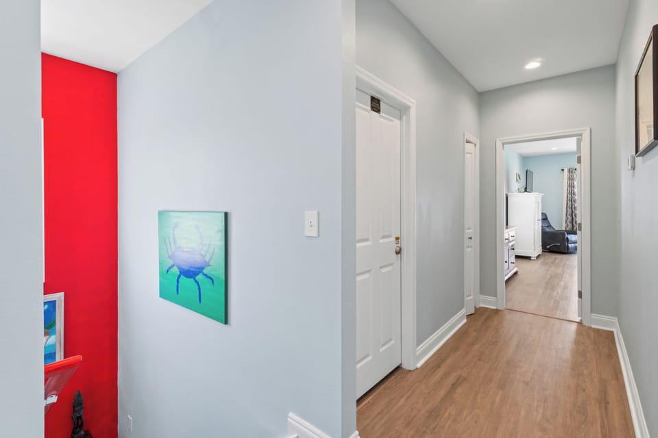 Step into your stylish hallway where modern art meets vibrant design, connecting you to comfortable living spaces throughout your home.