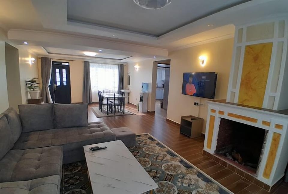 Family Villa, Balcony, Garden View | Living area | 32-inch Smart TV with digital channels