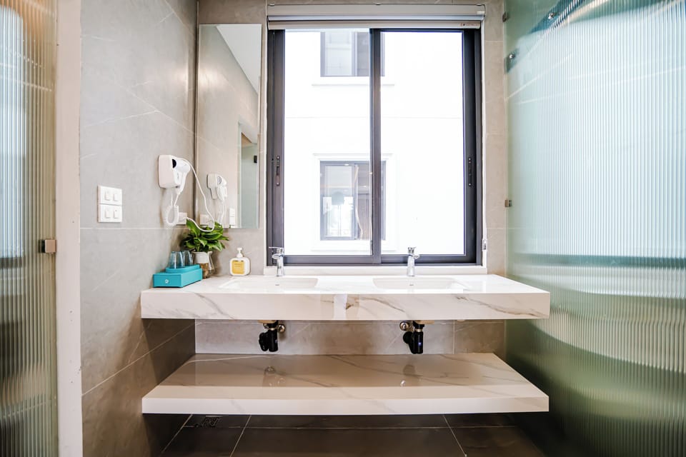 Luxury Studio Suite, Balcony, City View | Bathroom | Separate tub and shower, hair dryer, slippers, bidet