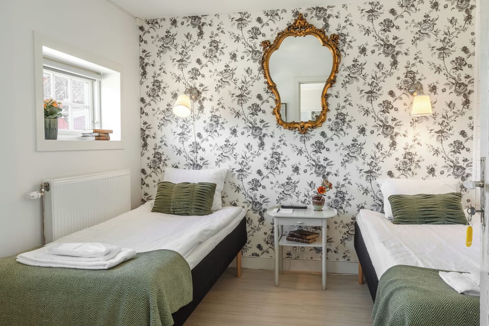 Twin Room, Partial Sea View | Iron/ironing board, free WiFi, bed sheets