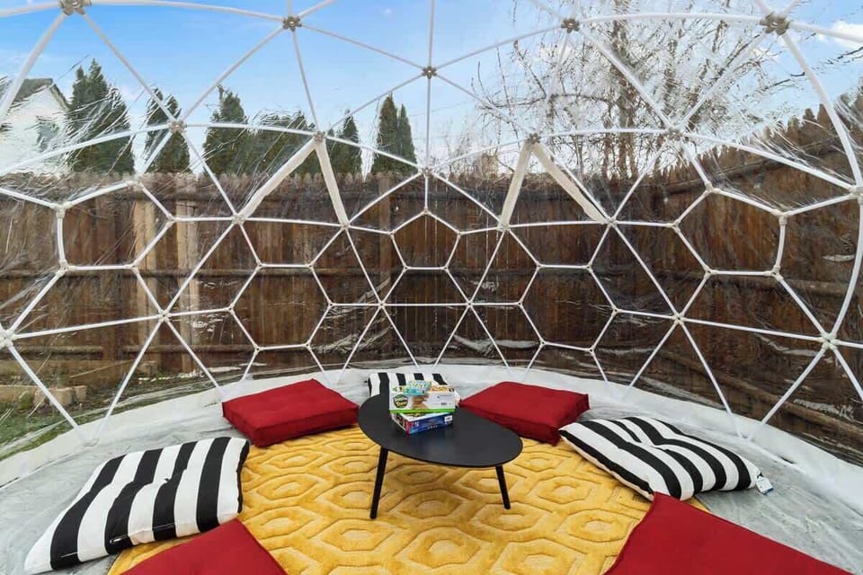 Relax in our unique patio dome, featuring plush seating that invites you to unwind in comfort and style, rain or shine.