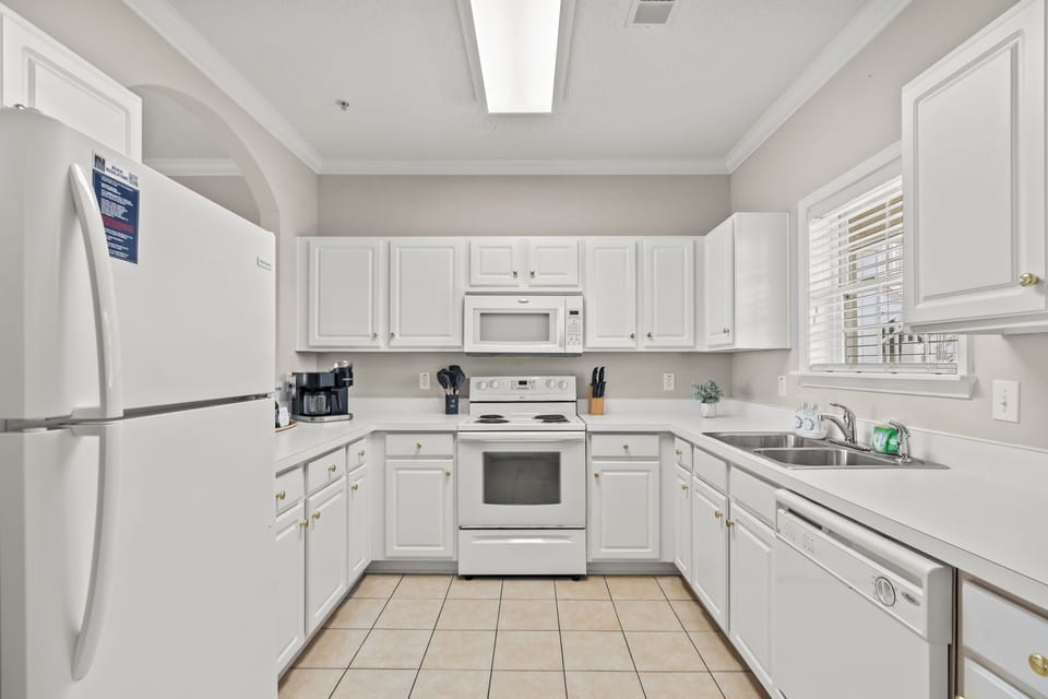 Fully stocked kitchen with all cookware, utensils, bakeware, and storage!