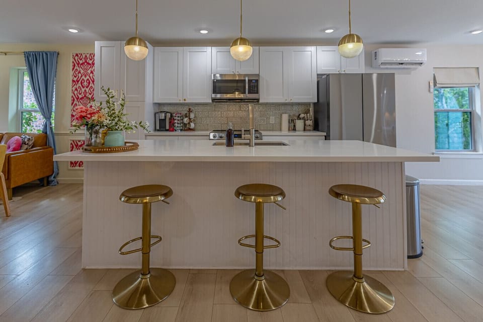 Slide onto a gold bar stool with your morning coffee and ease into the day in the bright, welcoming 2nd floor kitchen.