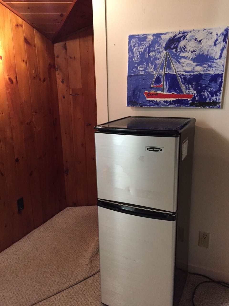 entry and small fridge