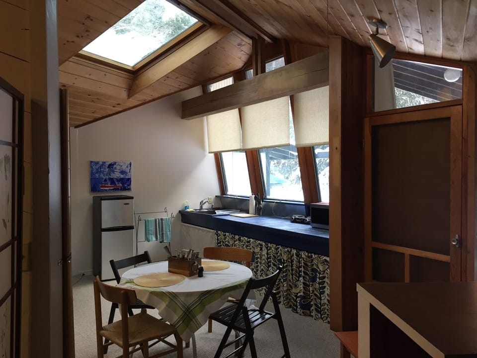 Dining/kitchen and large windows overlooking gardens