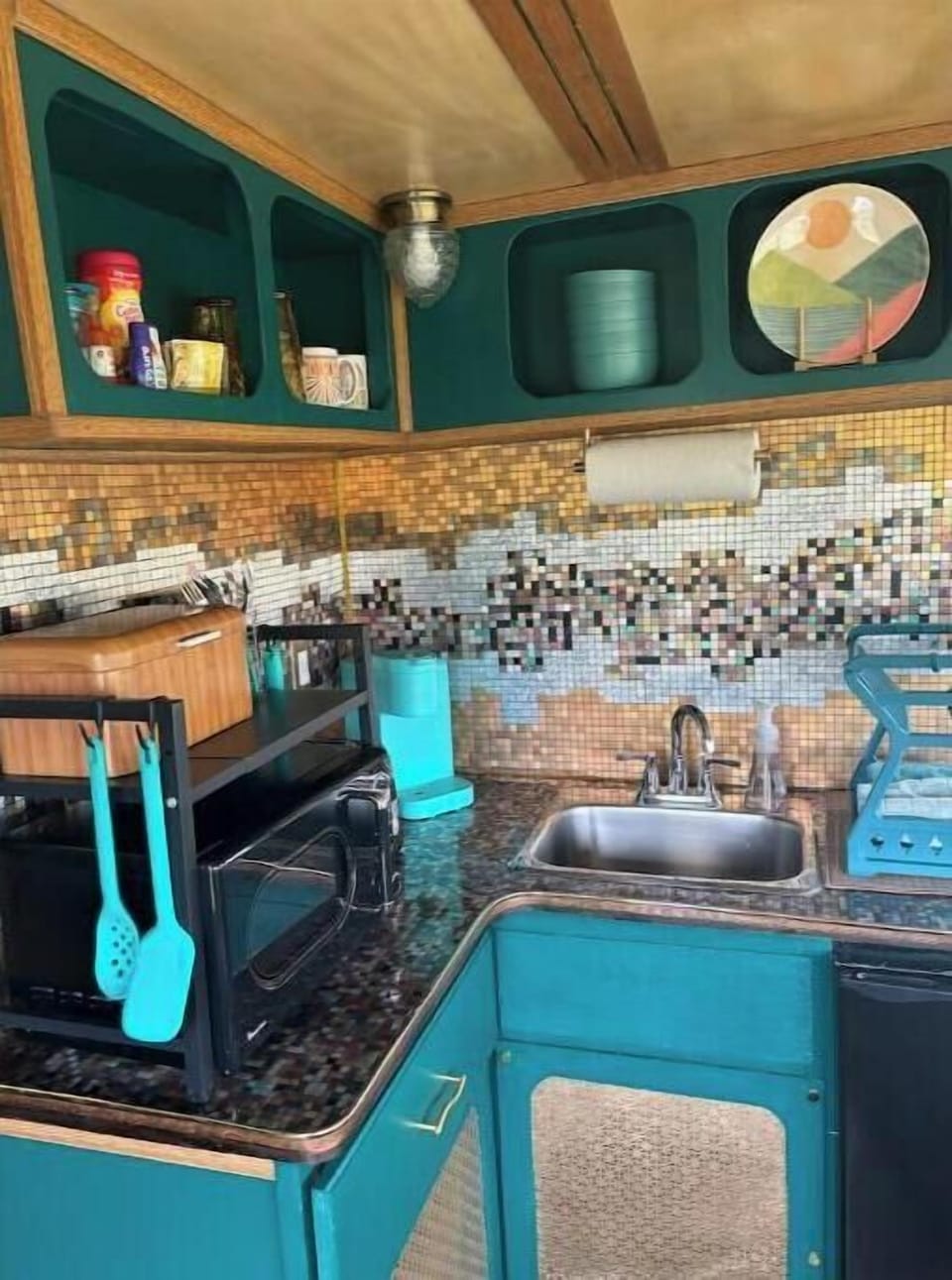 Kitchen with fridge, microwave, toaster and coffee maker
