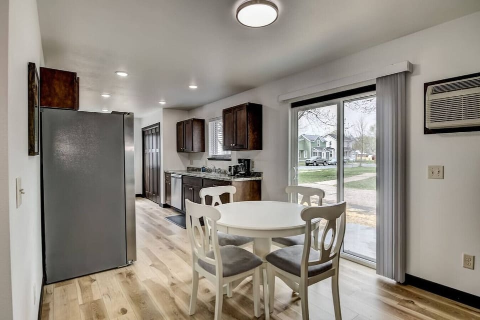 Dining room and kitchen. Siding door leads to the backyard.