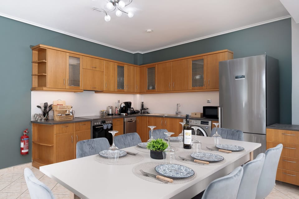 Deluxe Apartment, City View | Private kitchen | Dishwasher, electric kettle, highchair
