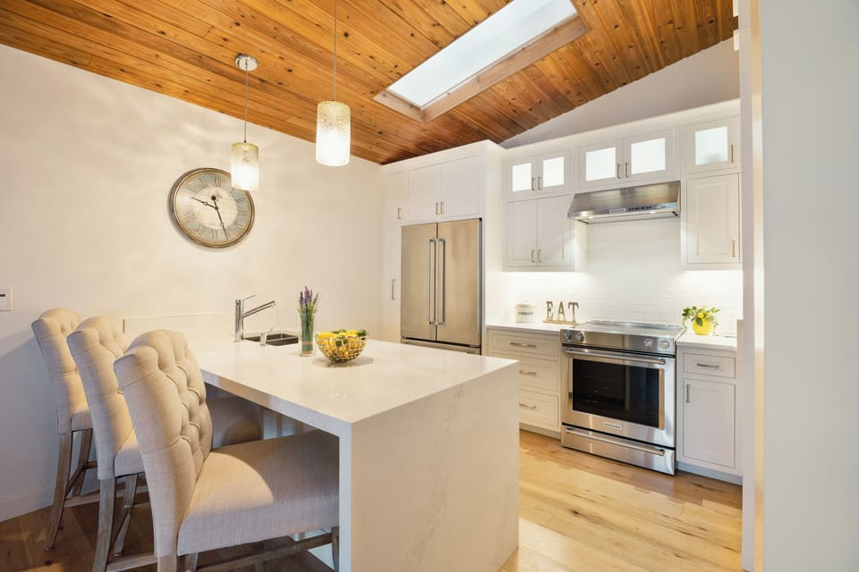 Kitchen with all appliances and cooking essentials 