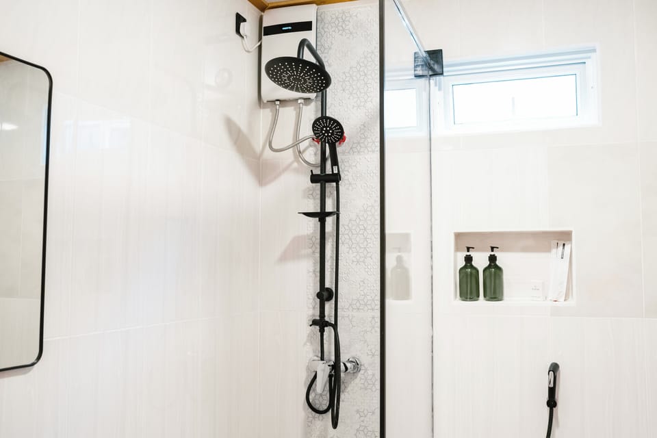 Shower, hair dryer, towels, soap