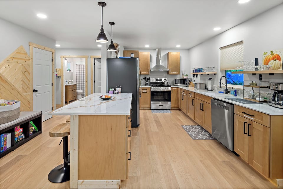 Gourmet kitchen with island seating and modern appliances