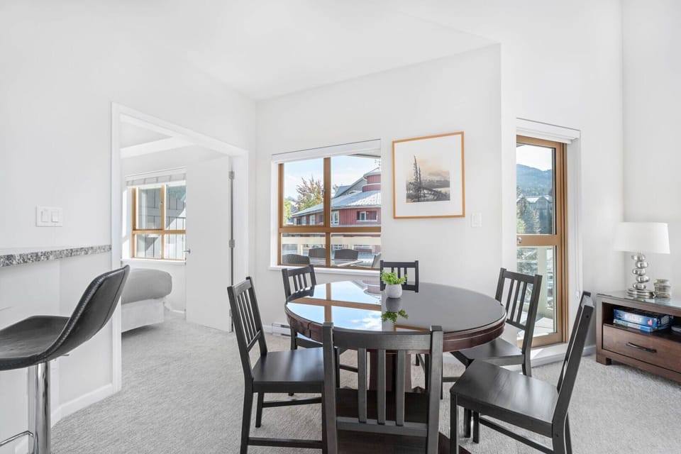 A circular dining table that can host 6 people