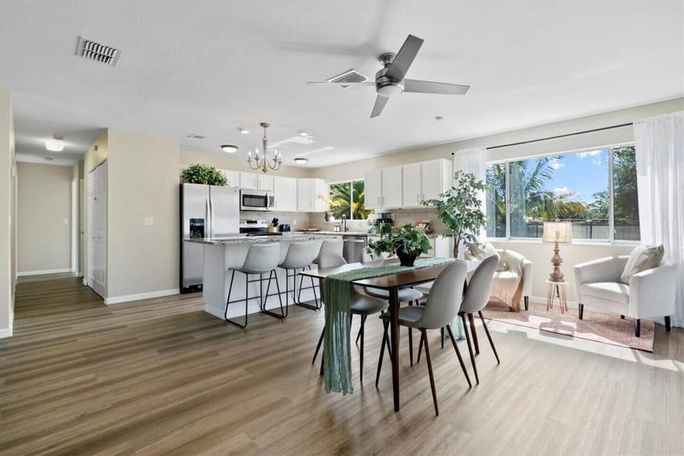 Open floorplan modern kitchen with dining area and sitting area