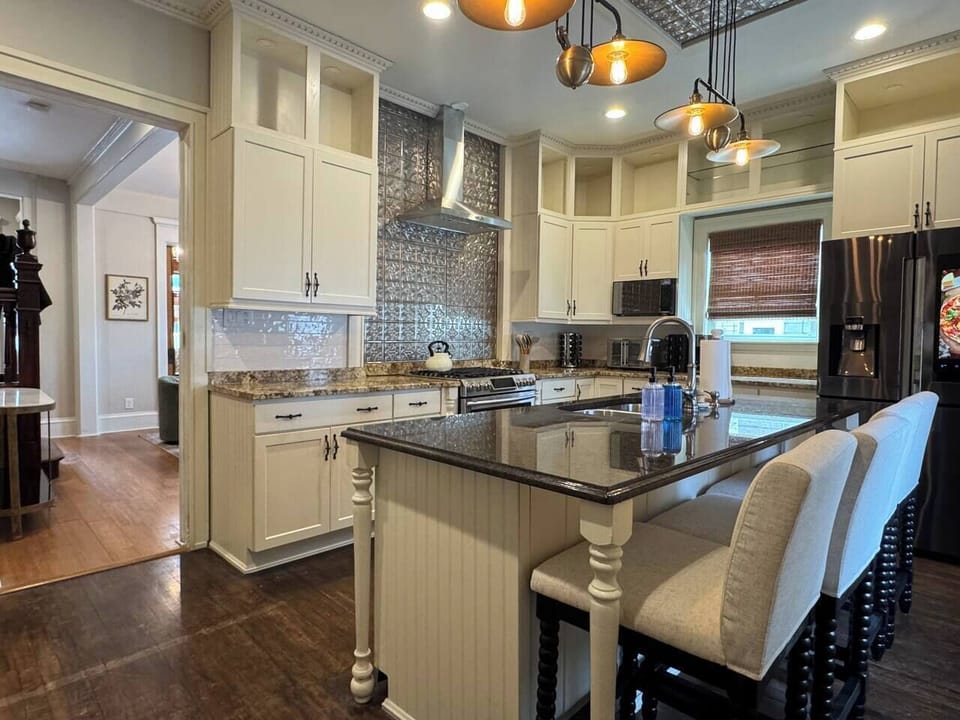 Spacious and stylish kitchen with granite countertops, and large center island