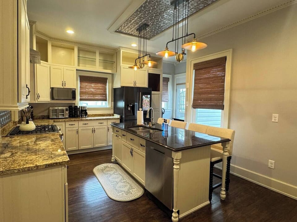 Spacious and stylish kitchen with granite countertops, and large center island