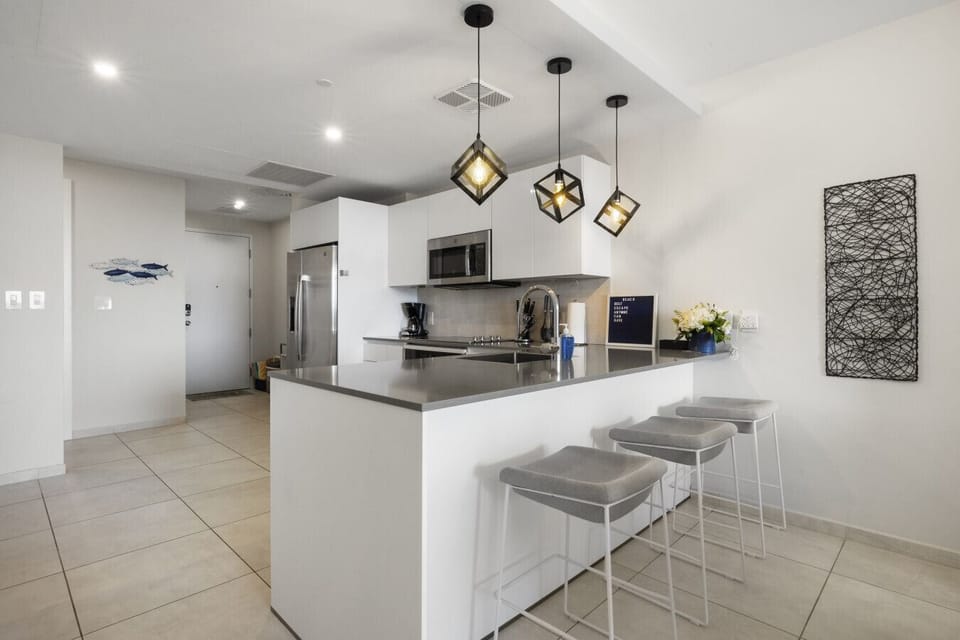 Enjoy casual dining at this stylish kitchen island, perfect for morning coffee or evening chats. Modern design meets functionality in this inviting space!