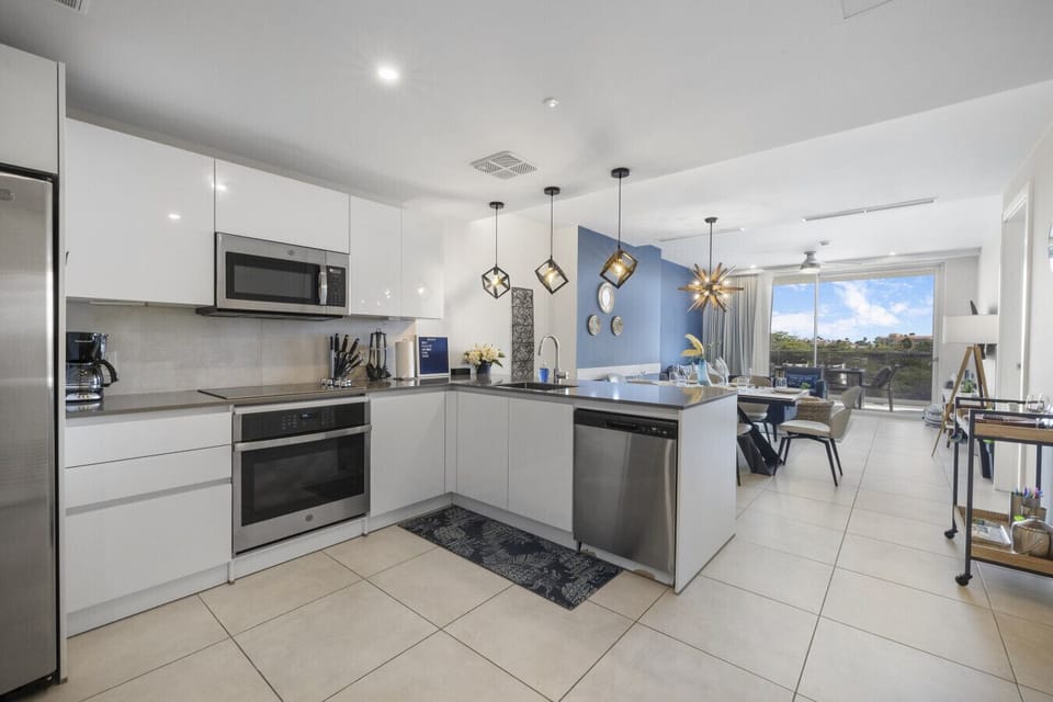 Cook and entertain in this sleek, modern kitchen equipped with top-notch appliances and an open layout that flows into the dining area.