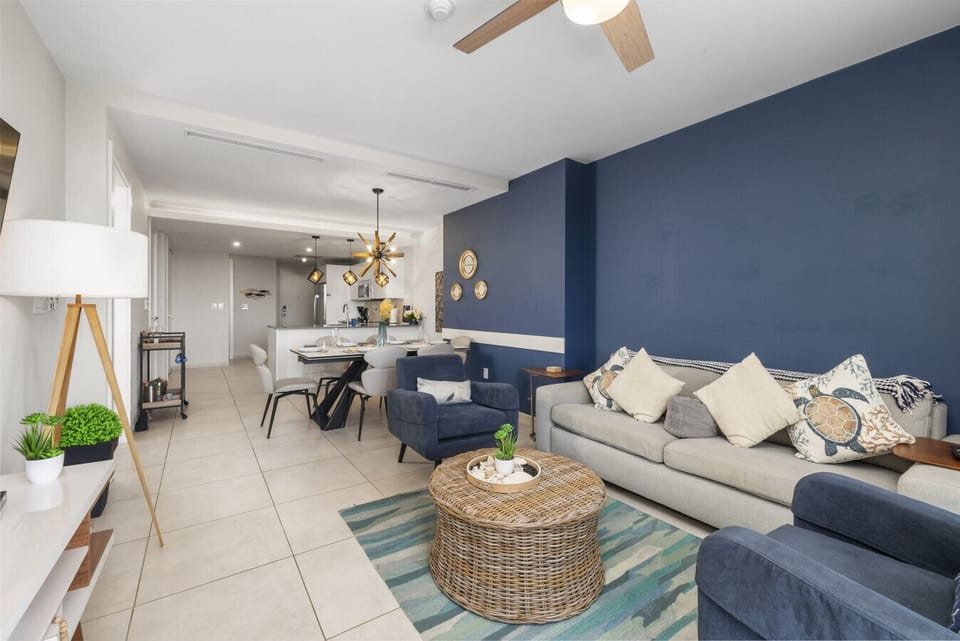 Embrace island living in this stylish open-concept space, where modern design meets cozy comfort. Perfect for gatherings and relaxation!