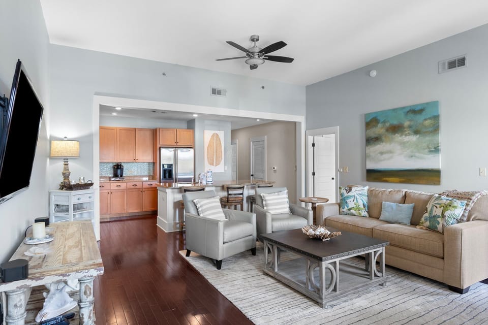 Modern kitchen connected to spacious dining and living areas.
